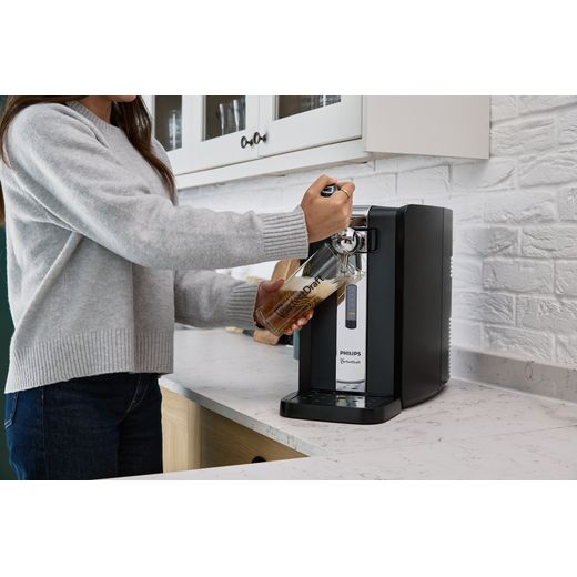 PerfectDraft Draft Beer Dispenser - lifestyle - woman pouring beer from dispenser